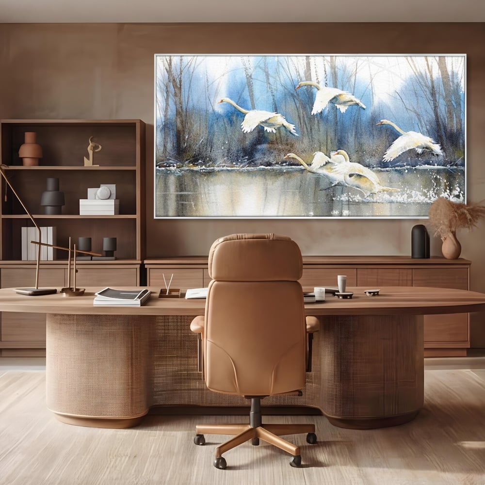 Tablou canvas cu pictura cu lebede pe apa, in rama de aluminiu argintiu, pe perete intr-un birou